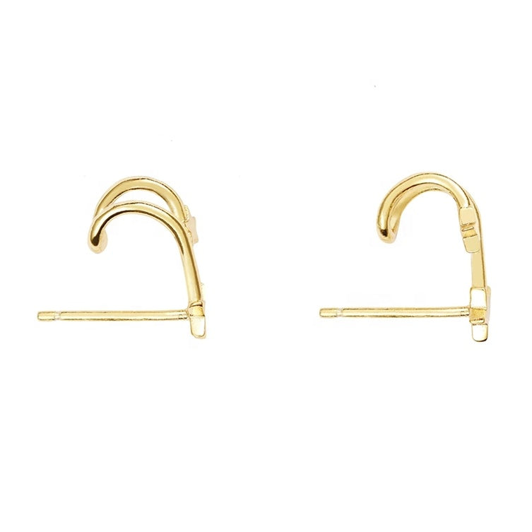 Side look of double star huggie earrings gold