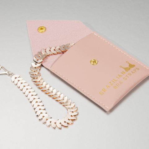 pink shiny bra straps on a pink gift pouch