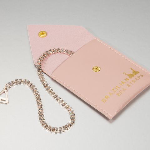 2 rose gold bra straps in a pink gift pouch
