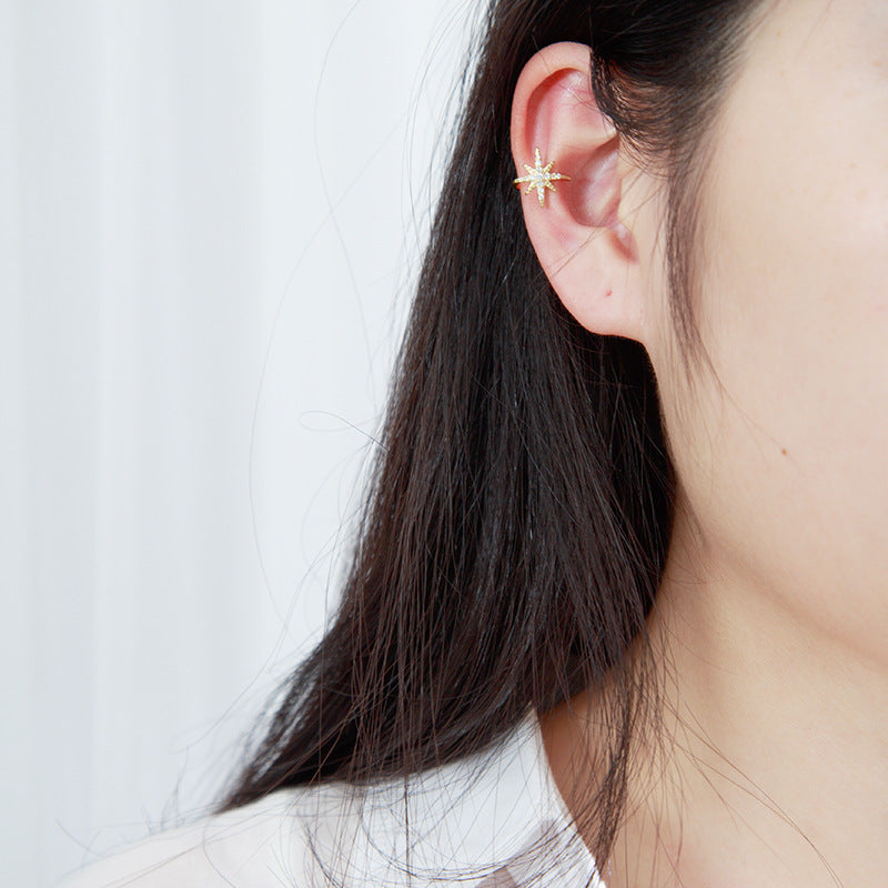 Gold ear cuff with star and crystals