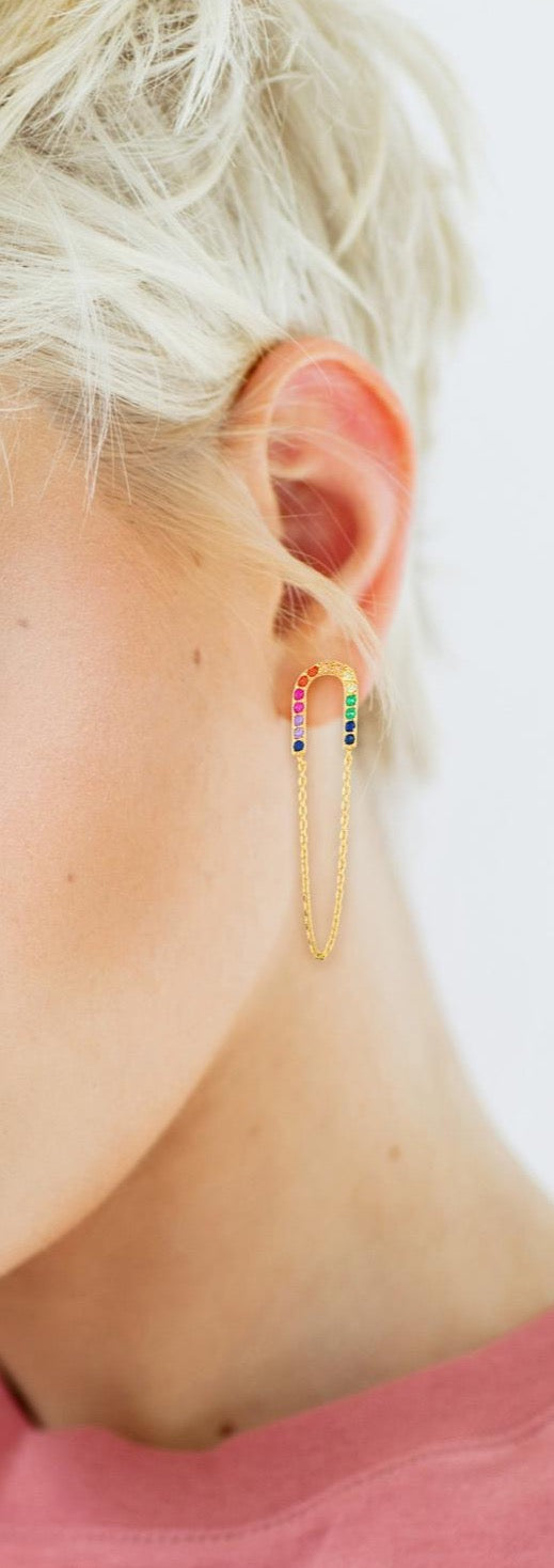 Rainbow gold earrings on model